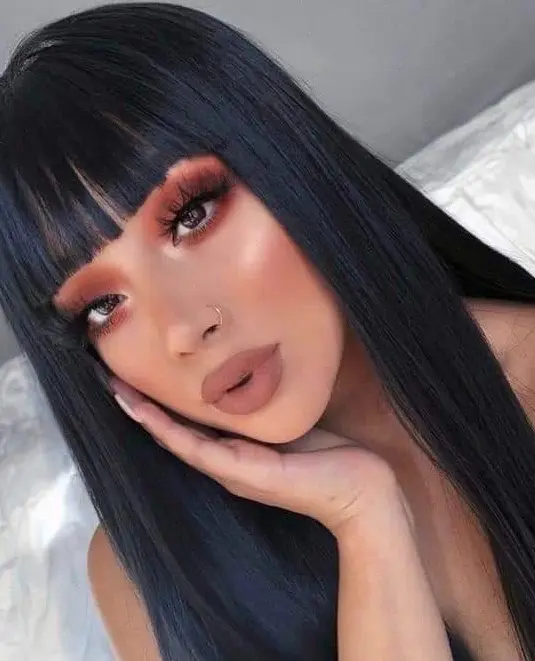 Sleek Black Hair with Blunt Bangs Hairstyle