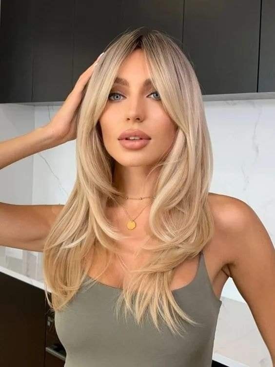 Blonde Layers with Curtain Bangs