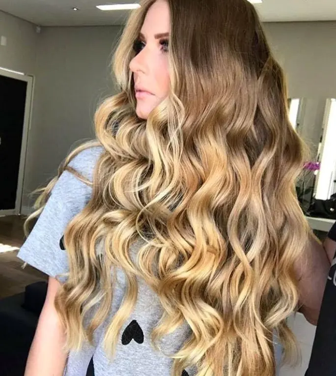 Long Blonde Waves with a Dark Root Hairstyle