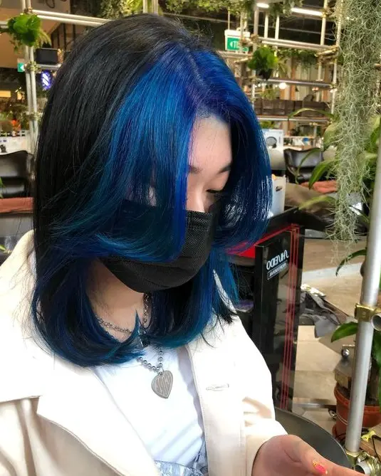 Vibrant Blue Streaks on Bob Cut