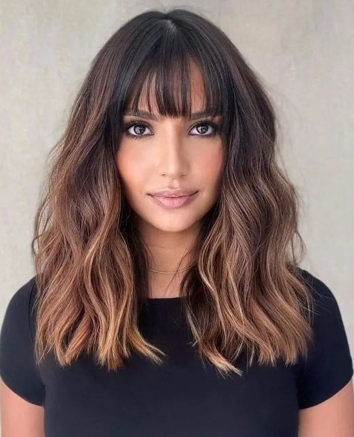 Wavy Brown Hair with Bangs Hairstyle