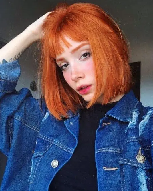 Fiery Orange Bob with Bangs Hairstyle