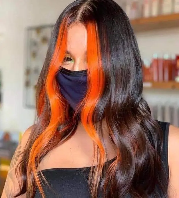 Bold Orange Face-Framing Highlights Hairstyle