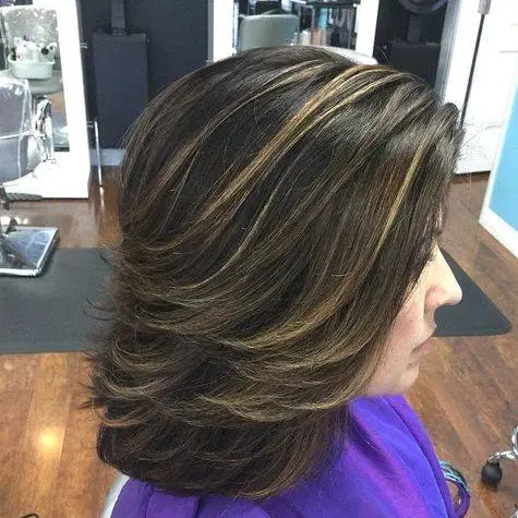 Golden Highlights on Brunette Layers Hairstyle