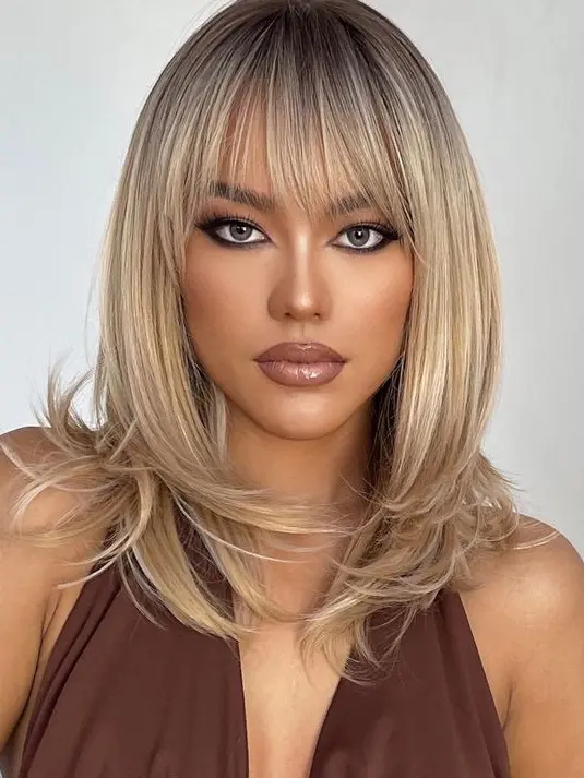 Blonde Layered Bob with Bangs Hairstyle