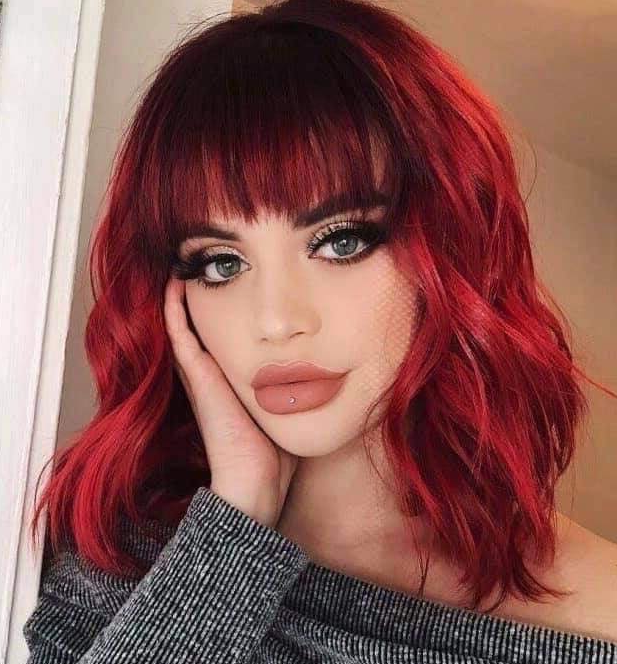 Fiery Red Wavy Lob with Bangs Hairstyle