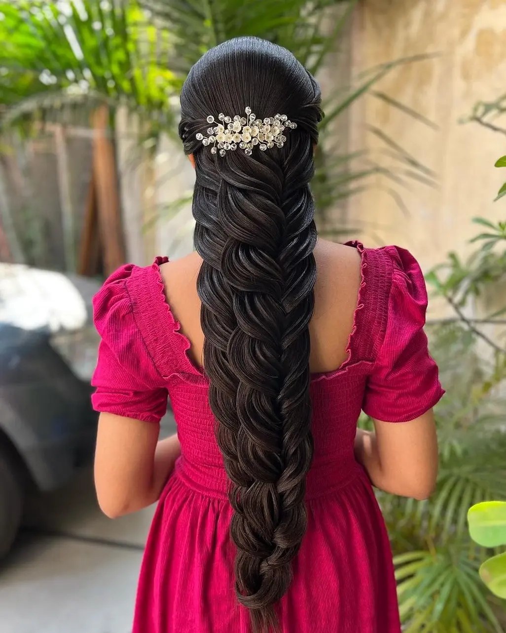 Intricate Fishtail Braid with Floral Pin