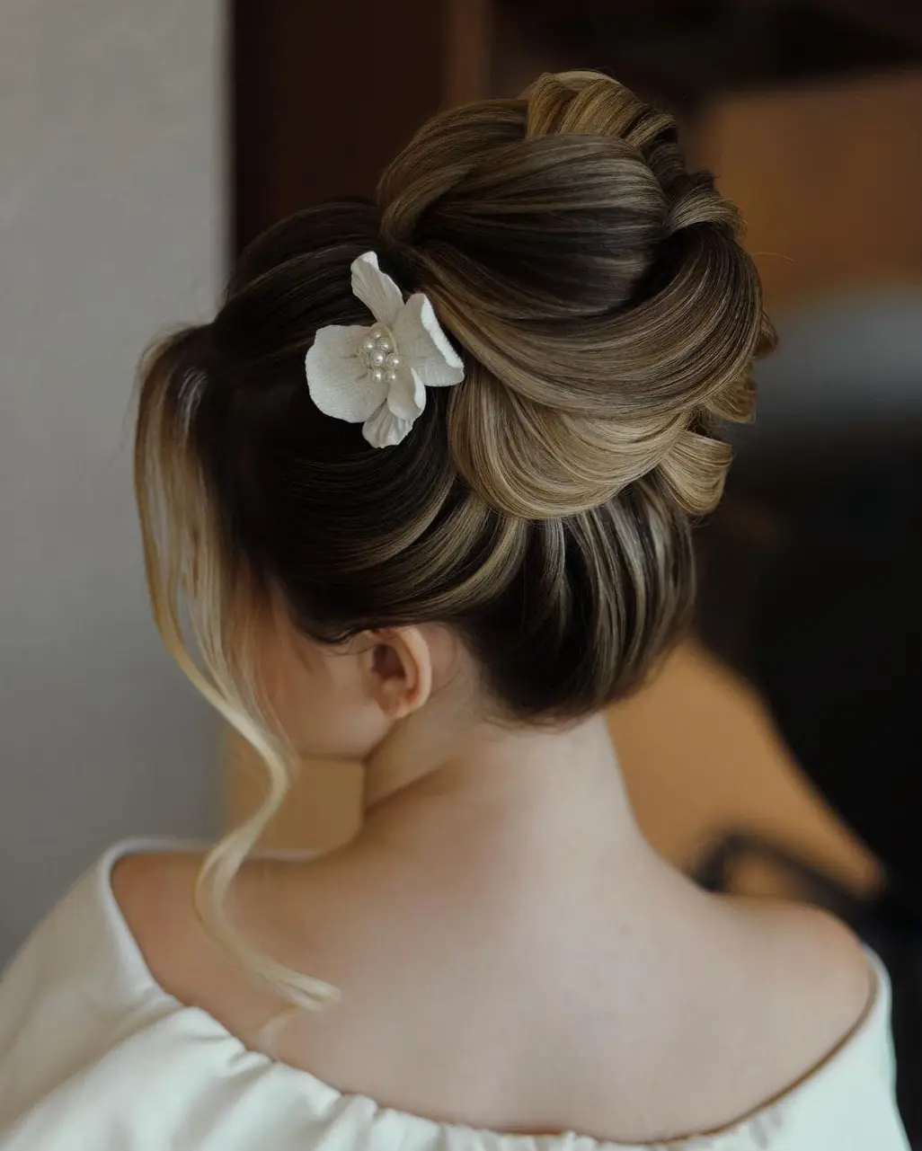 Elegant Updo with Floral Accessory